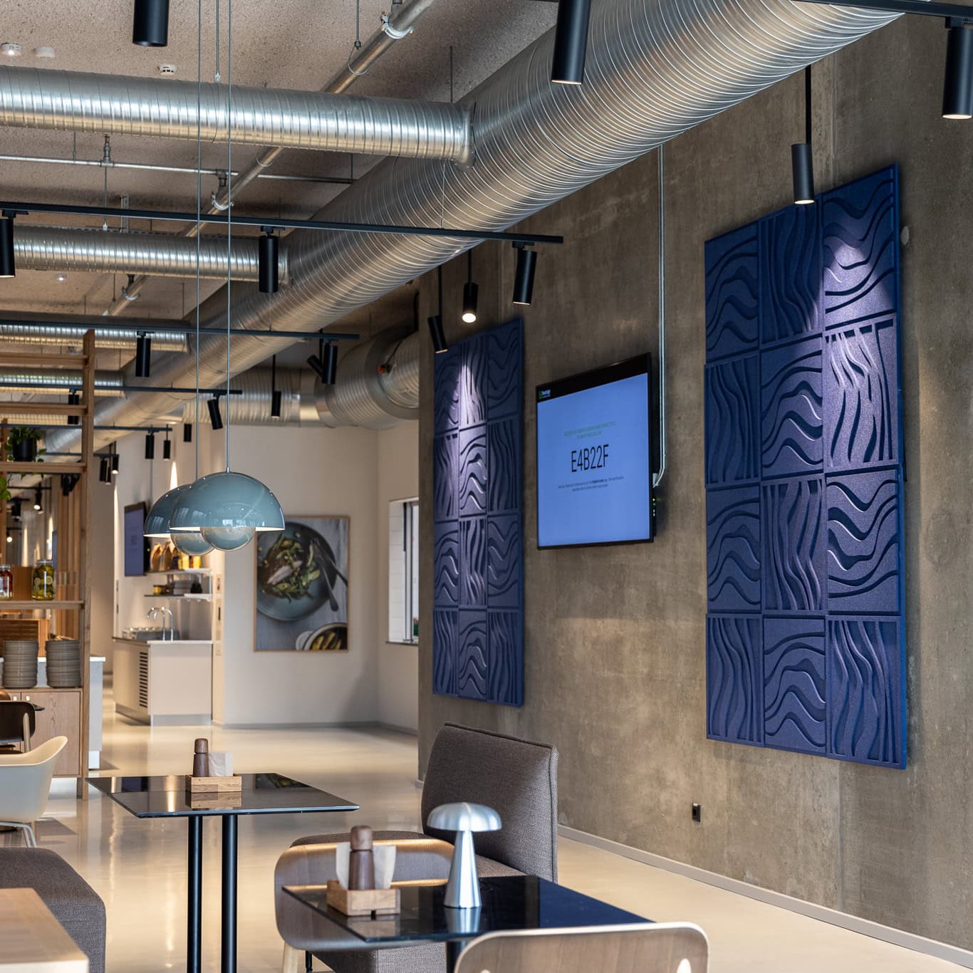 Arturel acoustic panels installed in office space to reduce RT60 and balance speech frequencies for clarity.