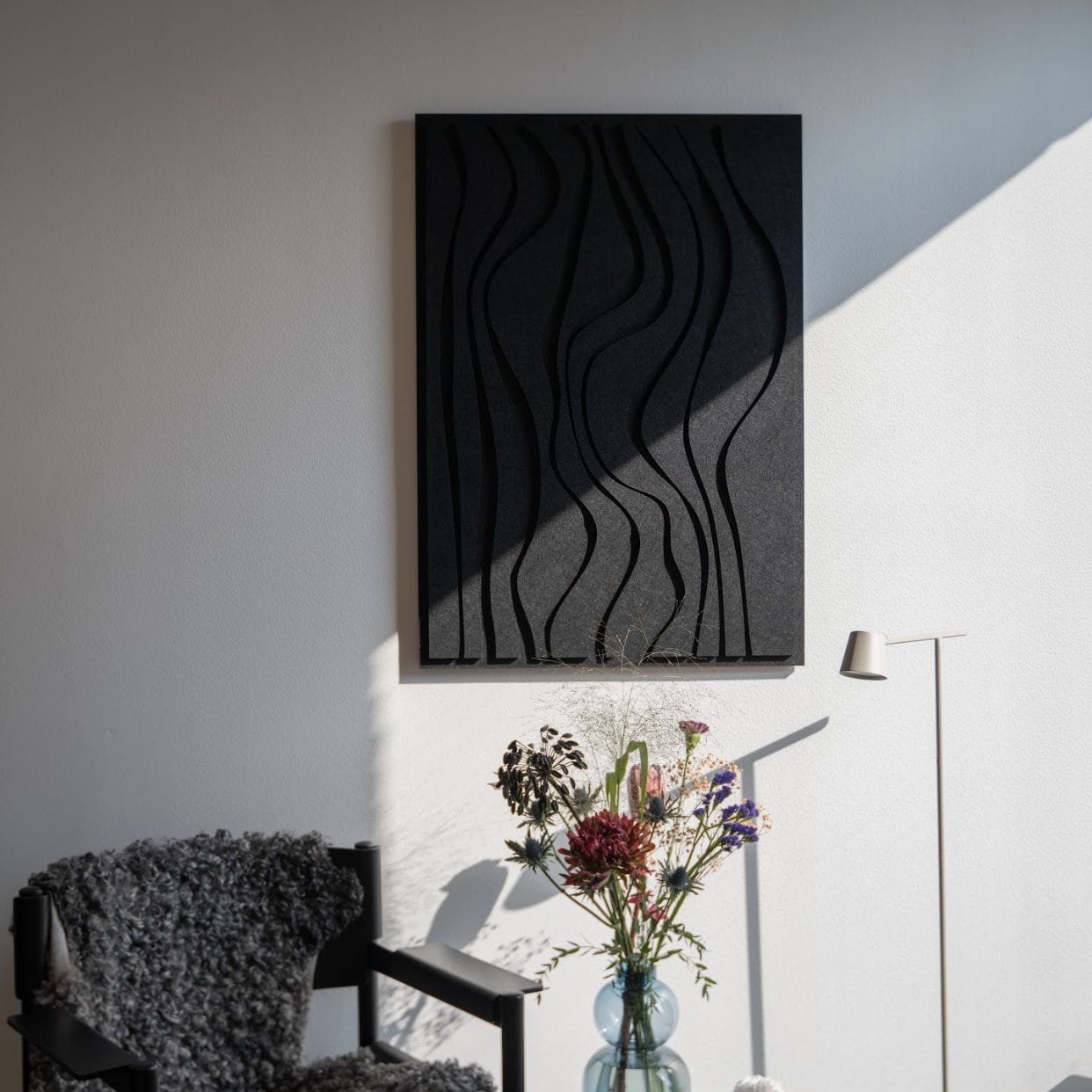 Arturel Waves black acoustic art panel in a living room for optimal acoustics