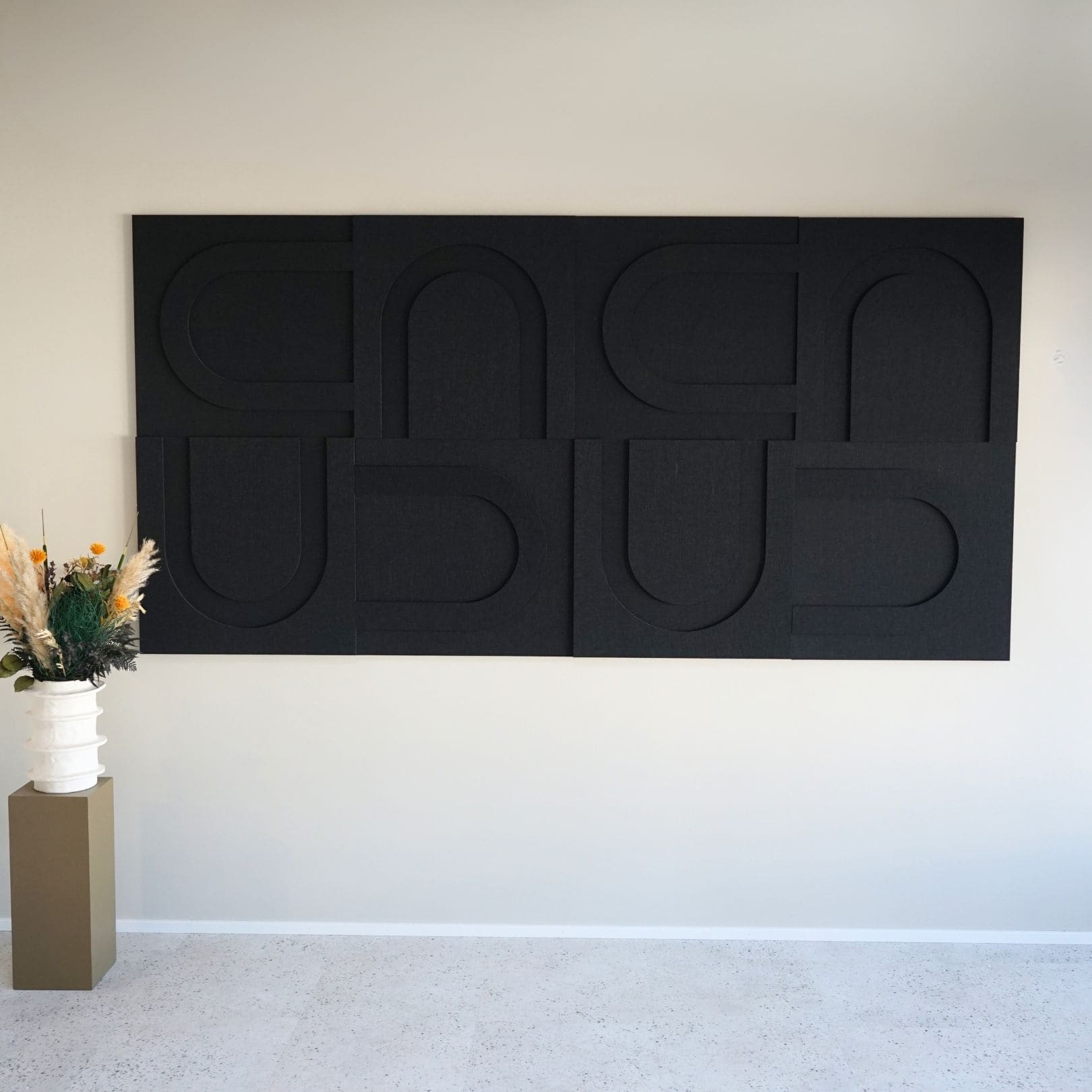 Black decorative acoustic wall panels from Arturel, designed to enhance sound quality and modern decor.